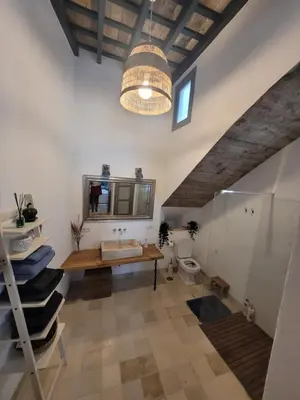 a bathroom with a sink and a toilet at Casa del Museo - Agua in Medina Sidonia