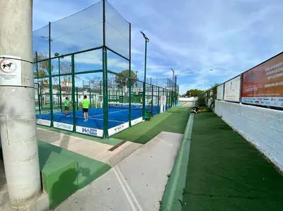 a tennis court with people on the court at MyChoice Alegria in Rota