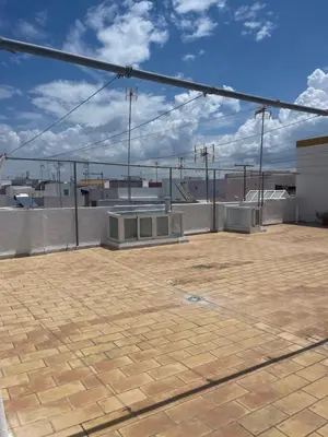 a rooftop with a brick floor and a sky at Acogedor apartamento in Rota
