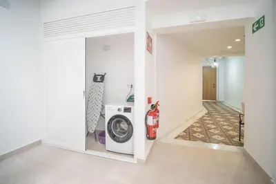 a laundry room with a washer and a washing machine at Sanlucar Centro - Apartamento 1 in Sanlúcar de Barrameda