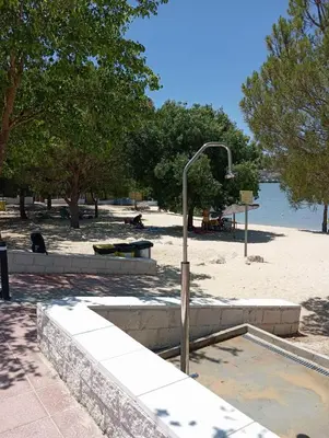a street light in a park next to a beach at Leo's Home in Arcos de la Frontera
