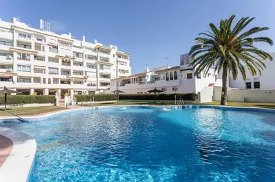 a large swimming pool in front of a building at Vistahermosa Piscina Vistas in El Puerto de Santa María