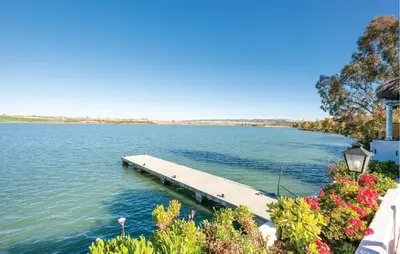 a dock in the middle of a body of water at Casa Chico in Arcos de la Frontera