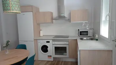 a kitchen with a stove top oven next to a microwave at Apartamento Mar III in San Fernando