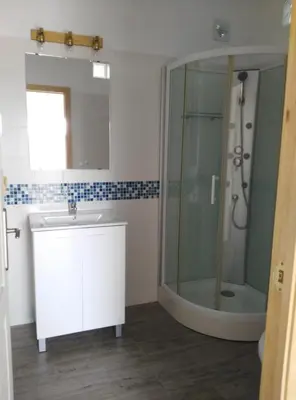 a bathroom with a sink and a shower at Casa MARINERA in Cádiz