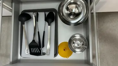 a cupboard with utensils in a kitchen at Lacana 2 in Chiclana de la Frontera