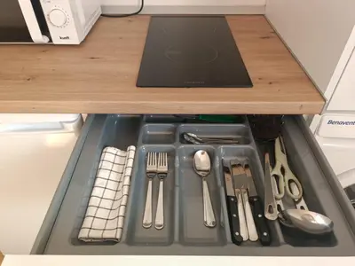 a drawer filled with utensils in a refrigerator at Apartamento La Bota in Jerez de la Frontera