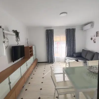 a living room with a couch and a table at Casa Álamo in Puerto Real