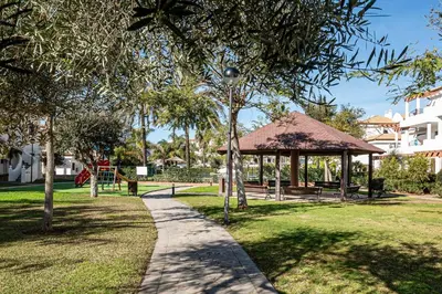 a path in a park with a gazebo at coto 8 22 in Chiclana de la Frontera