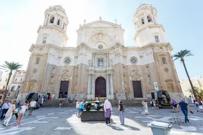 a group of people standing in front of a church at La VICTORIA Home free parking by Cadiz4Rentals in Cádiz