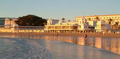 a group of buildings on a beach near the water at CDZ - Poniente in Cádiz
