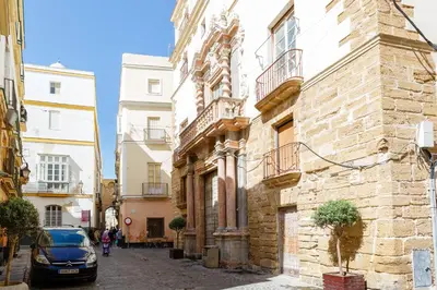 a car parked on a street next to buildings at Casa La Muralla MEDIEVAL by Cadiz4Rentals in Cádiz