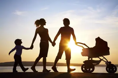 a family walking on the beach with their child at Balcones de CANDELARIA by Cadiz4Rentals in Cádiz