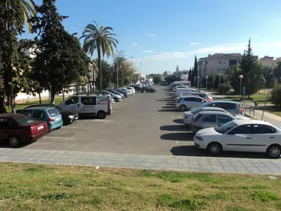 a row of cars parked in a parking lot at Apartamento Centro Jerez in Jerez de la Frontera