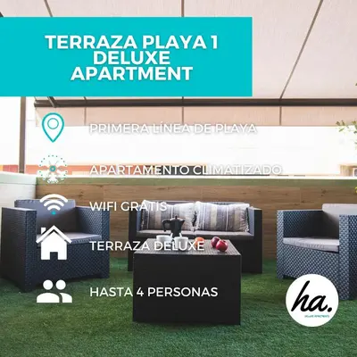 a booth at a furniture exhibition with a sofa and chairs at Terraza Playa de Cádiz 1 Ha Apartment in Cádiz