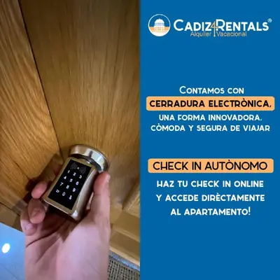 a person holding a cell phone in a wooden door at Atico La JOYITA free parking by Cadiz4Rentals in Cádiz