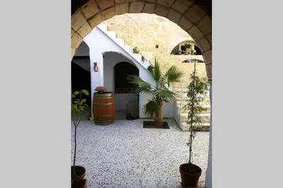 an archway with potted plants in a courtyard at Casa Florinda #7 in Jerez de la Frontera