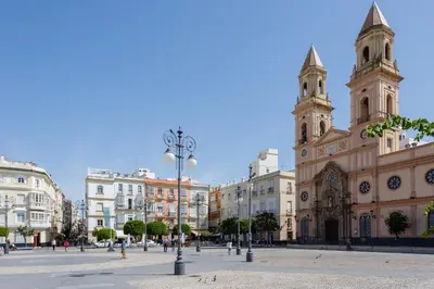 a large building with two towers in a city at Apartamentos La BRUJULA by CadizRentals in Cádiz