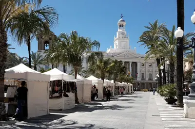 a street with white tents in front of a building at Estudio Las Navas in Cádiz