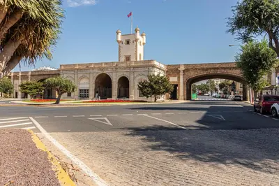 a building with a clock tower on top of it at Allo Apartments San Roque 1ºA in Cádiz