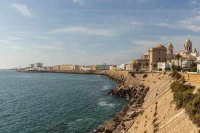 a view of the ocean and buildings on the shore at Allo Apartments San Roque 1ºB in Cádiz