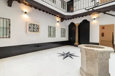 a large room with a stone pillar in the middle at Allo Apartments San Roque 2ºB in Cádiz