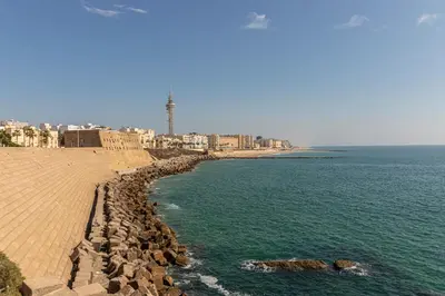a view of the ocean with a beach and buildings at Allo Apartments San Roque 3ºB in Cádiz