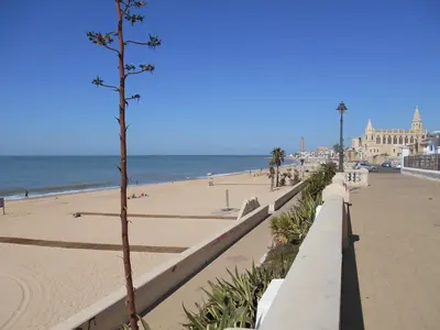a view of the beach and the ocean at Penthouse Sleeps 4 with Private Garden in Chipiona