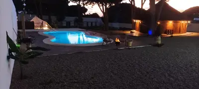 an overhead view of a swimming pool at night at CÁDIZ - BUDA, acogedor apartamento en Chiclana de la Frontera, España in Chiclana de la Frontera