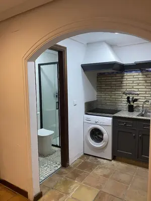 a laundry room with a washer and dryer at APARTAMENTOS LUZ DE LA BAHÍA SUR CADIZ San Fernando in San Fernando