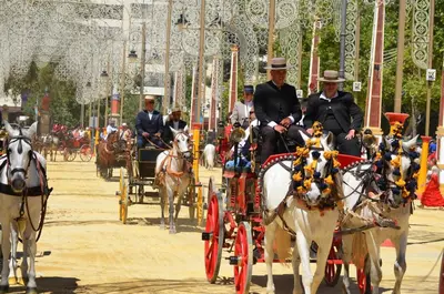 a group of people riding in a horse drawn carriage at Apartamento AstaRegia in Jerez de la Frontera